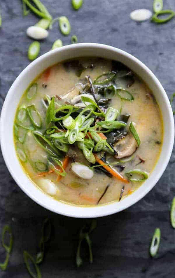 Homemade miso soup in a white bowl with vegetables