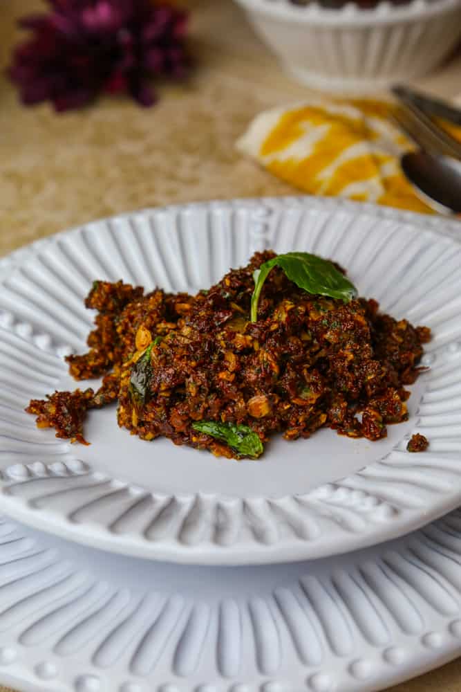 sun dried tomato tapenade with almonds and mint on a plate 