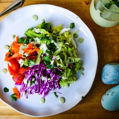 rainbow salad and green goddess dressing on a plate