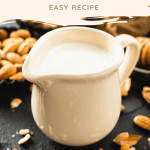 cup of almond milk with almonds and honey