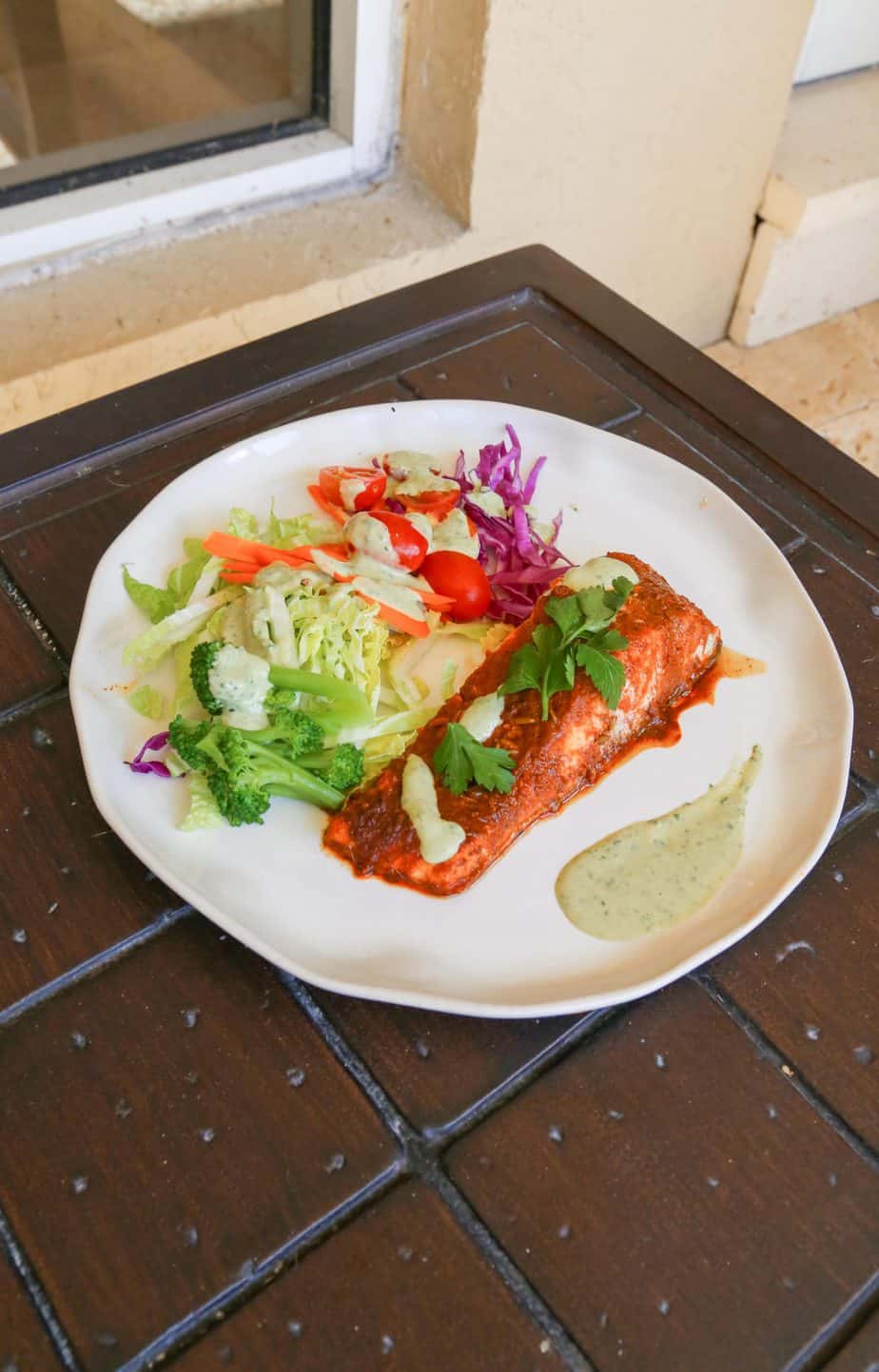 Peruvian salmon on a plate with salad 