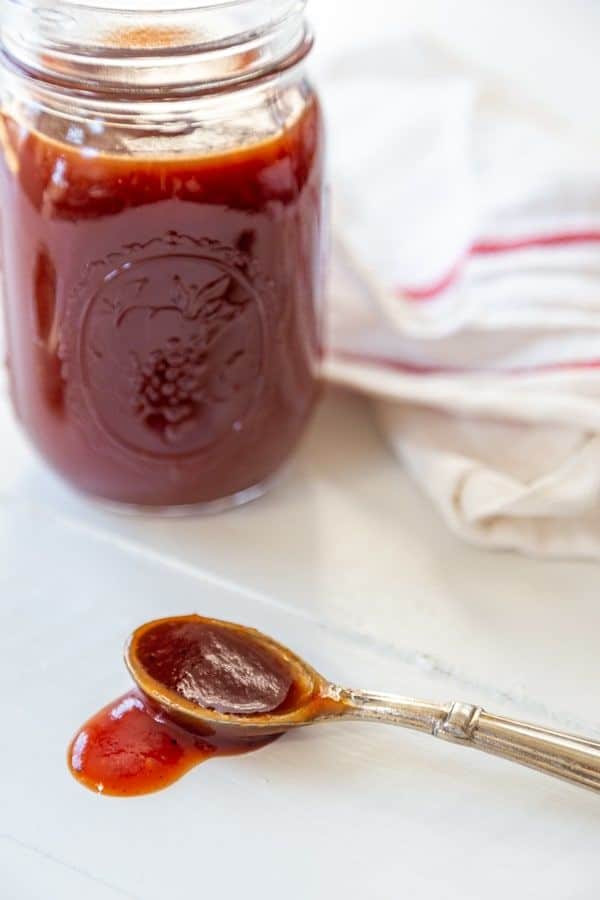 jar of vegan bbq sauce with spoon