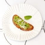 vegan pea pesto and mint crostini on a plate