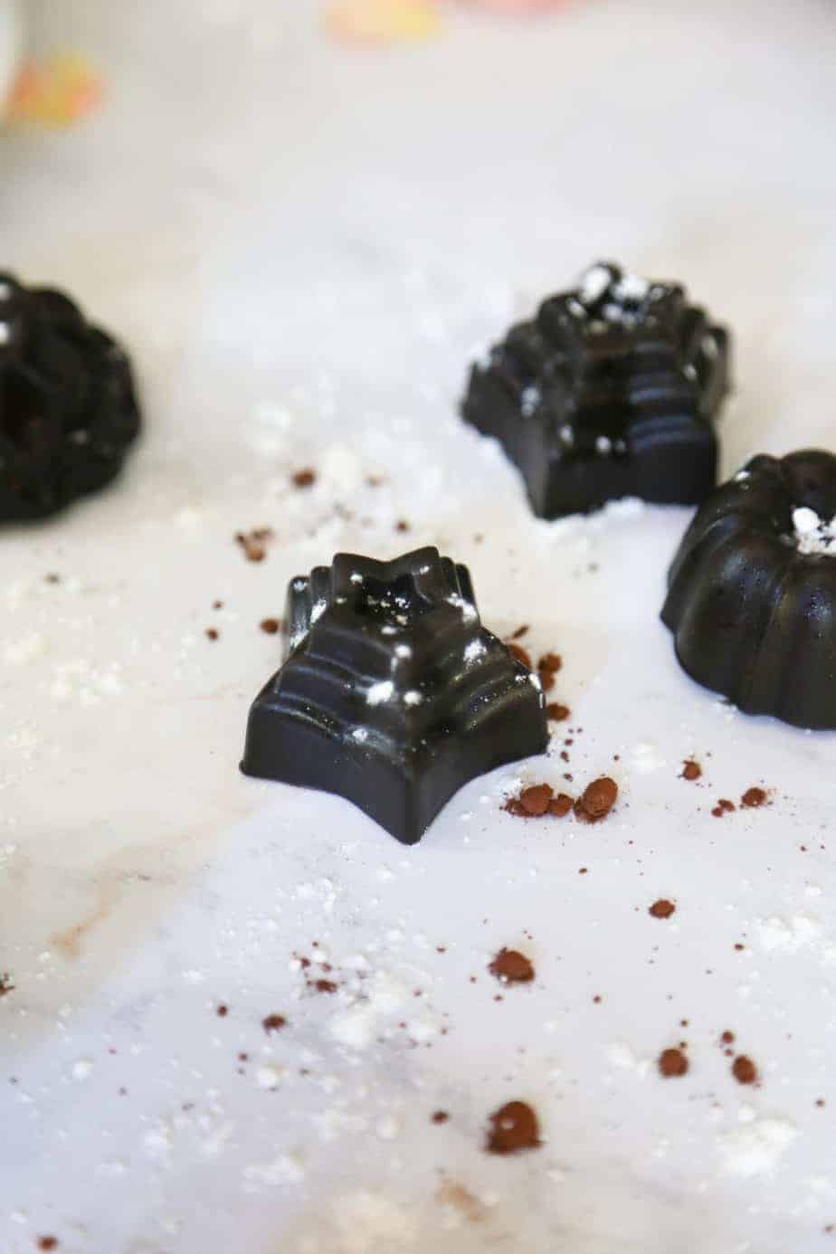 picture of chocolate bon bons with powdered sugar and cocoa powder 