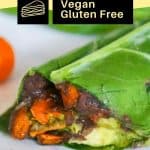 healthy Mexican collard green wrap with sweet potatoes onions and spicy green tahini sauce