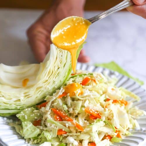 cabbage and carrot salad with carrot ginger miso dressing