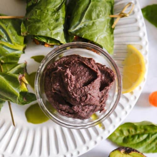 how to make a collard green wrap with refried black beans on a white plate