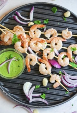 oven roasted shrimp kabobs with vegan Aji Verde sauce from above on a grill pan