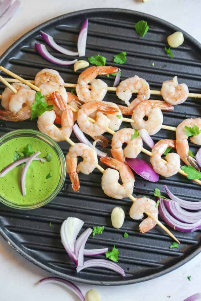 oven baked shrimp kabobs with Vegan Aji Verde sauce made with garlic tahini lemon juice cilantro parsley shrimp 