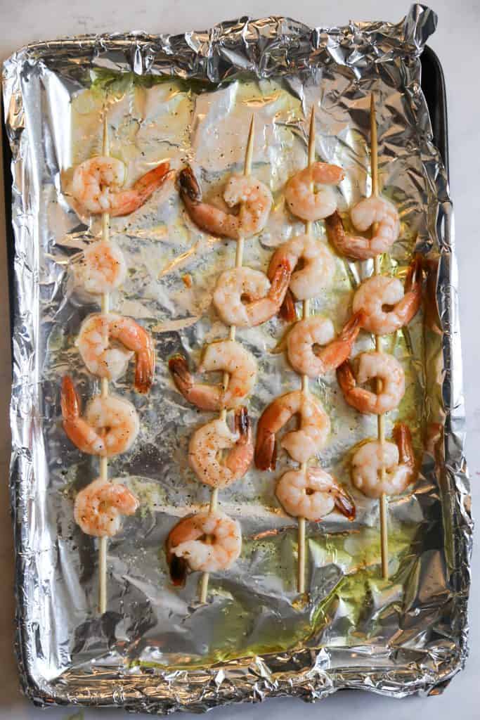 Process shot of oven roasted shrimp kabobs when done roasting 