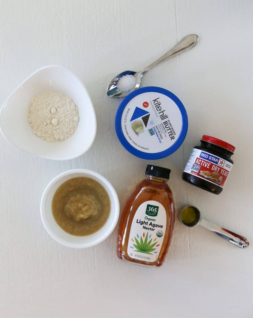 ingredients for vegan challah bread, flour, vegan butter salt yeast agave and olive oil and applesauce