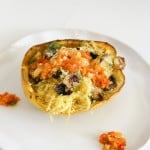 vegetarian stuffed spaghetti squash on a white plate