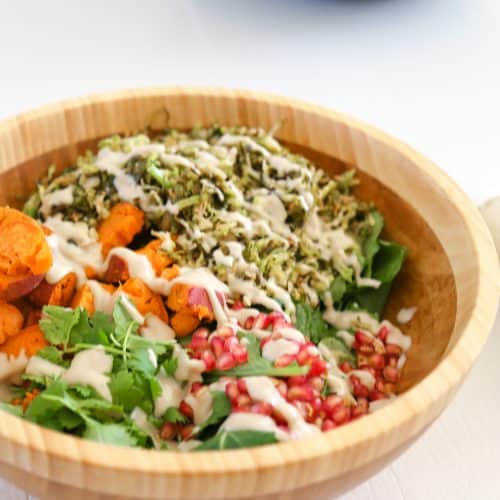 brussels sprouts salad vegan in a bowl with dressing
