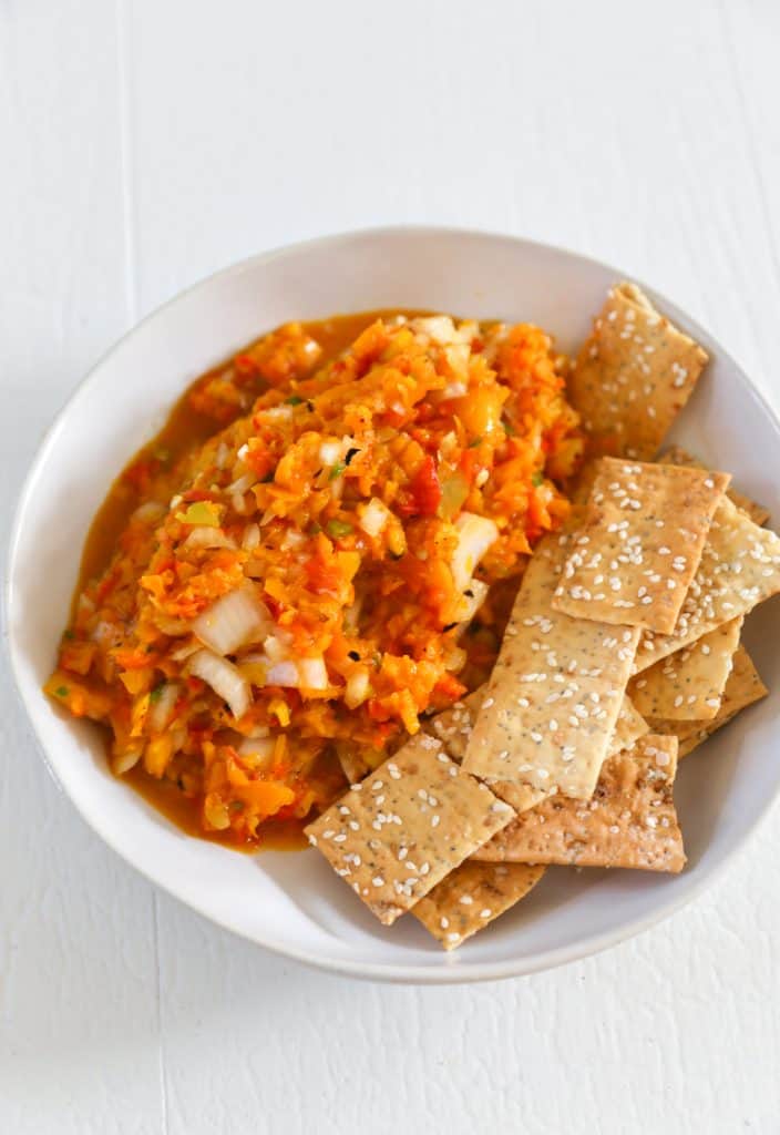 photo of roasted  pepper salsa in a white bowl with crackers