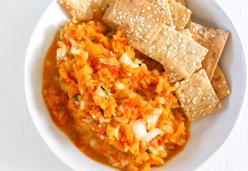 Roasted pepper salsa on a plate with chips 