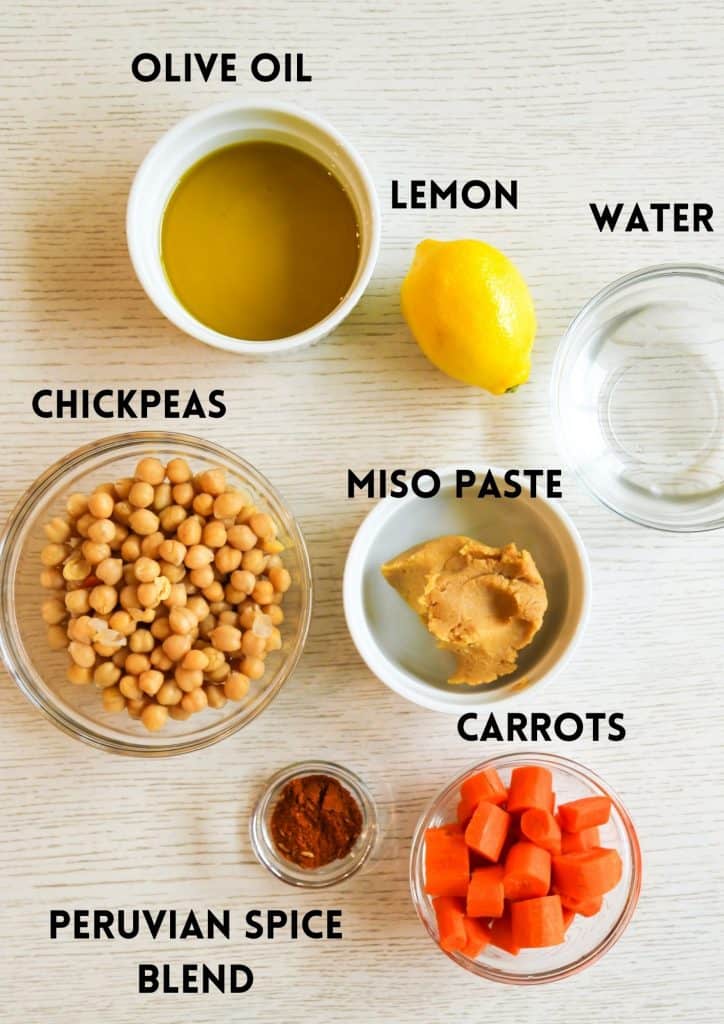 Ingredients for gluten free hummus, Olive oil, lemon, water, chickpeas, miso paste, carrots, Peruvian spice blend