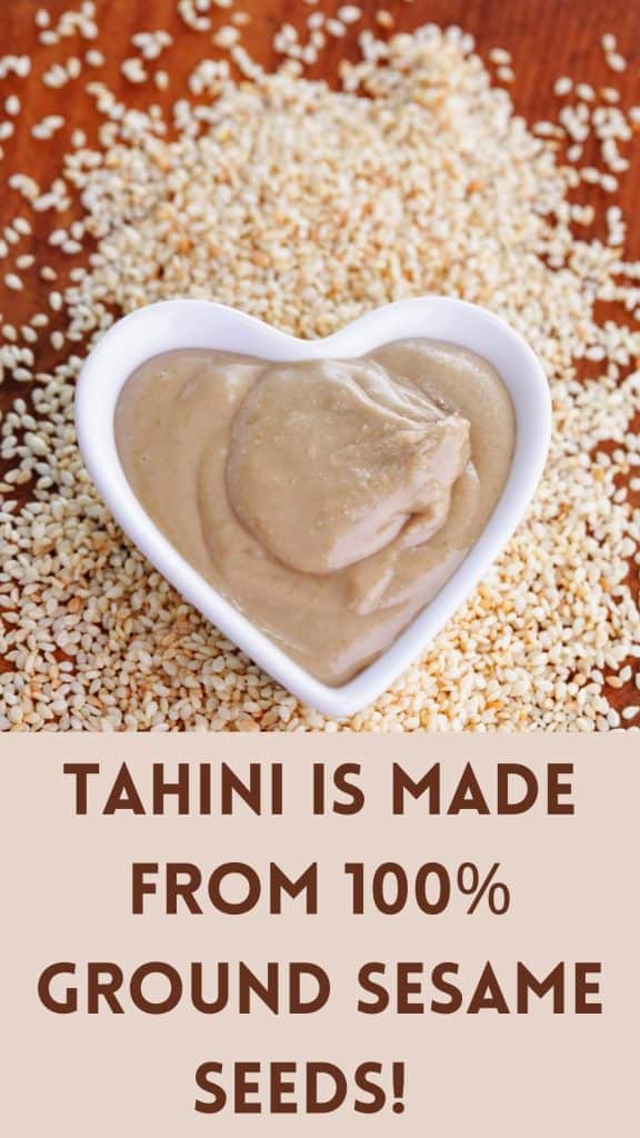 image of tahini in a heart shaped bowl on top of sesame seeds that says "tahini is made from 100% ground sesame seeds!"
