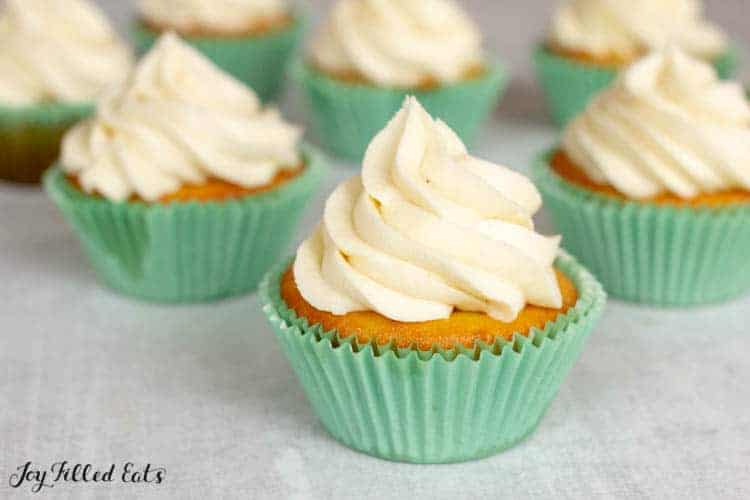 gluten free almond flour cupcakes with white butter cream frosting and blue foil