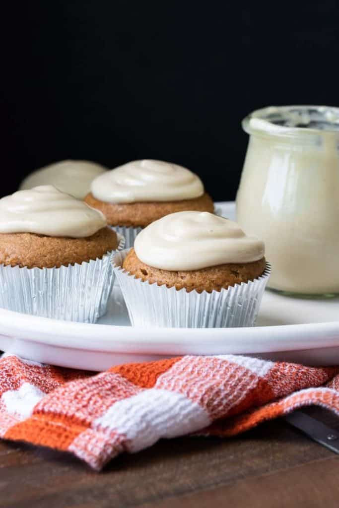 gluten free pumpkin cupcakes on a plate with.a red napkin