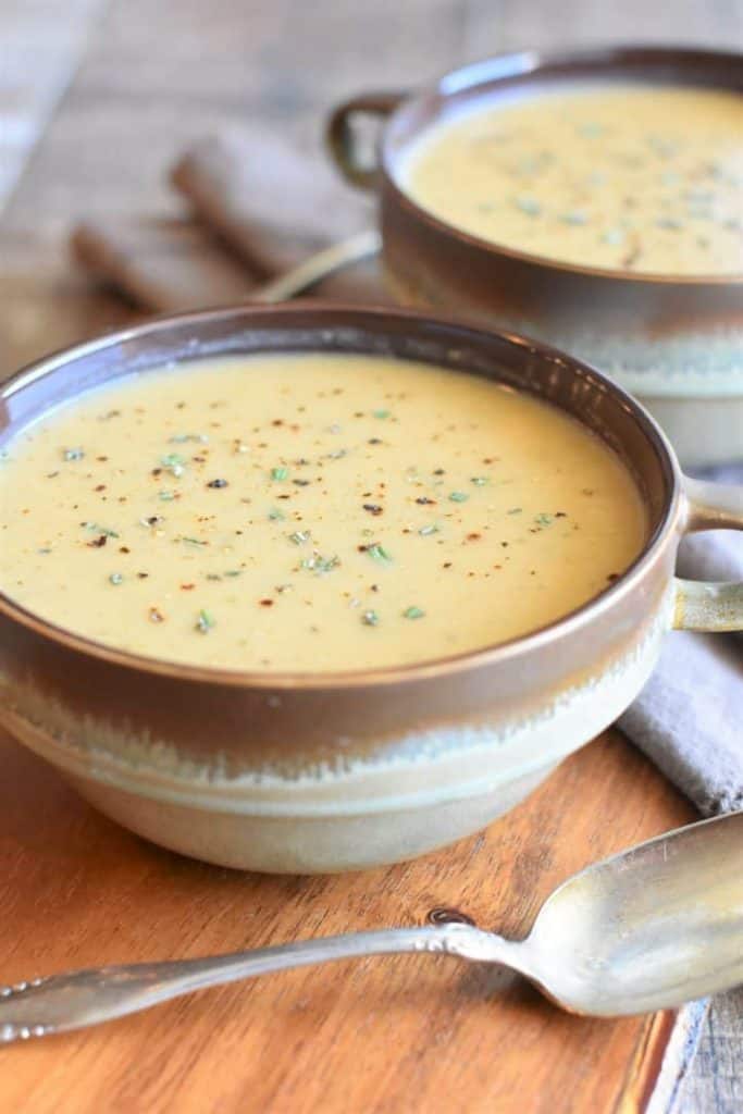 gluten free white bean soup in a bowl with a spoon