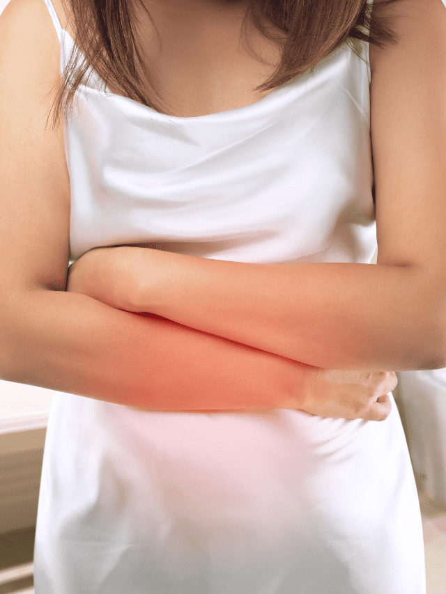 Girl with arms folded over her stomach