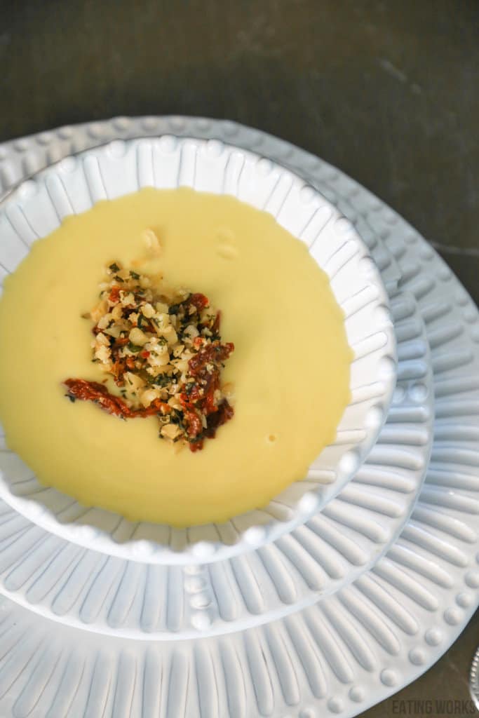 keto cauliflower soup with sundried tomato tapenade in a bowl