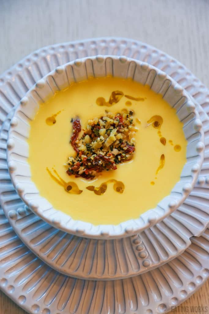 keto cauliflower soup with sundried tomato tapenade in a bowl