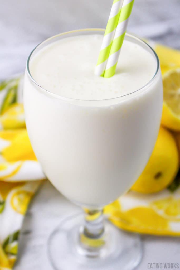 copycat chick-fil-a frosted lemonade copy cat recipe in a glass with green and white straws