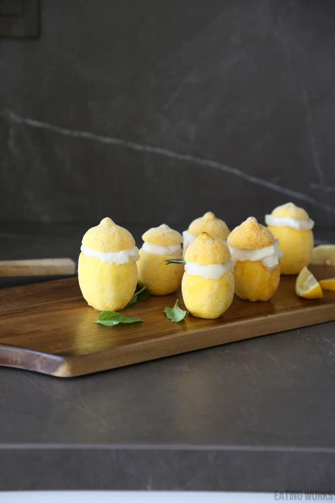 cutting board full of lemons served with lemon sorbet inside