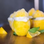 Italian lemon sorbet recipe on a cutting board with mint leaves