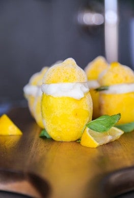Italian lemon sorbet recipe on a cutting board with mint leaves