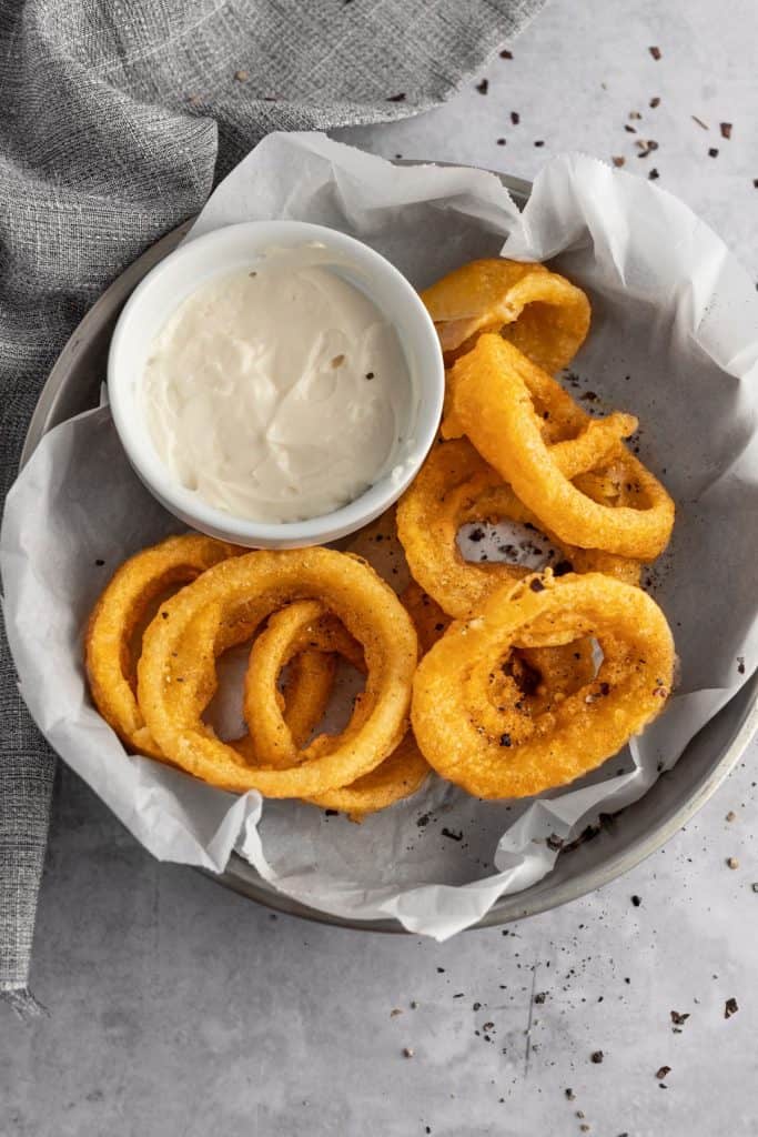 air fryer onion rings in a basket 