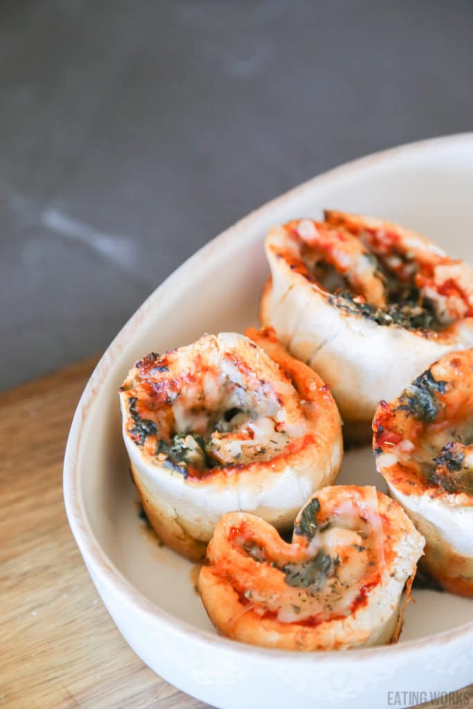 gluten free pizza rolls in a baking dish