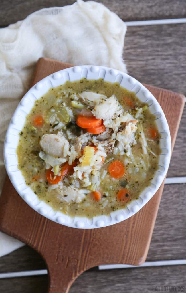 gluten free chicken soup in a white bowl on a cutting board 