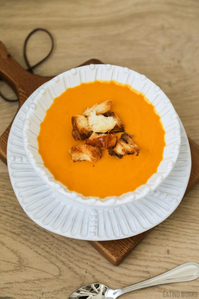 bowl of sweet potato and pumpkin soup with brioche croutons 