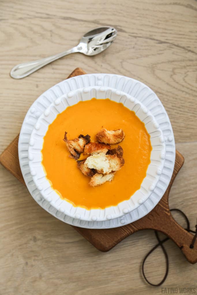 bowl of sweet potato and pumpkin soup with brioche croutons 