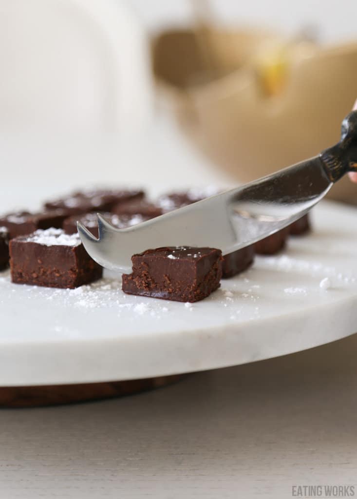 keto nama chocolate cut into with a knife 