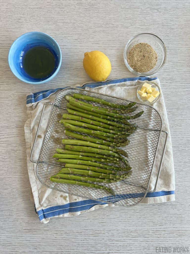 ingredients for air fryer asparagus, lemon, gluten-free breadcrumbs olive oil and butter