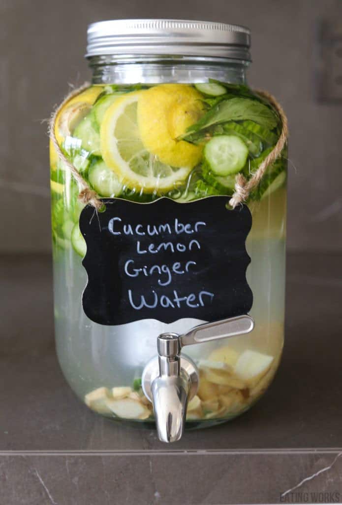 pitcher filled with cucumber lemon ginger water 