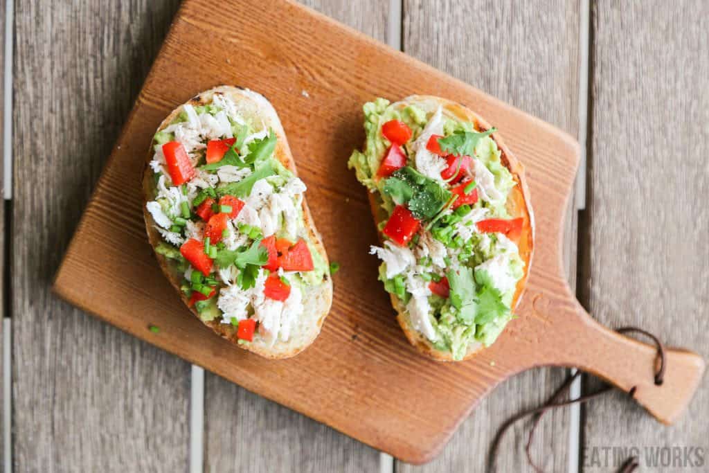 chicken avocado toast on a cutting board 