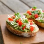 chicken avocado toast on a cutting board