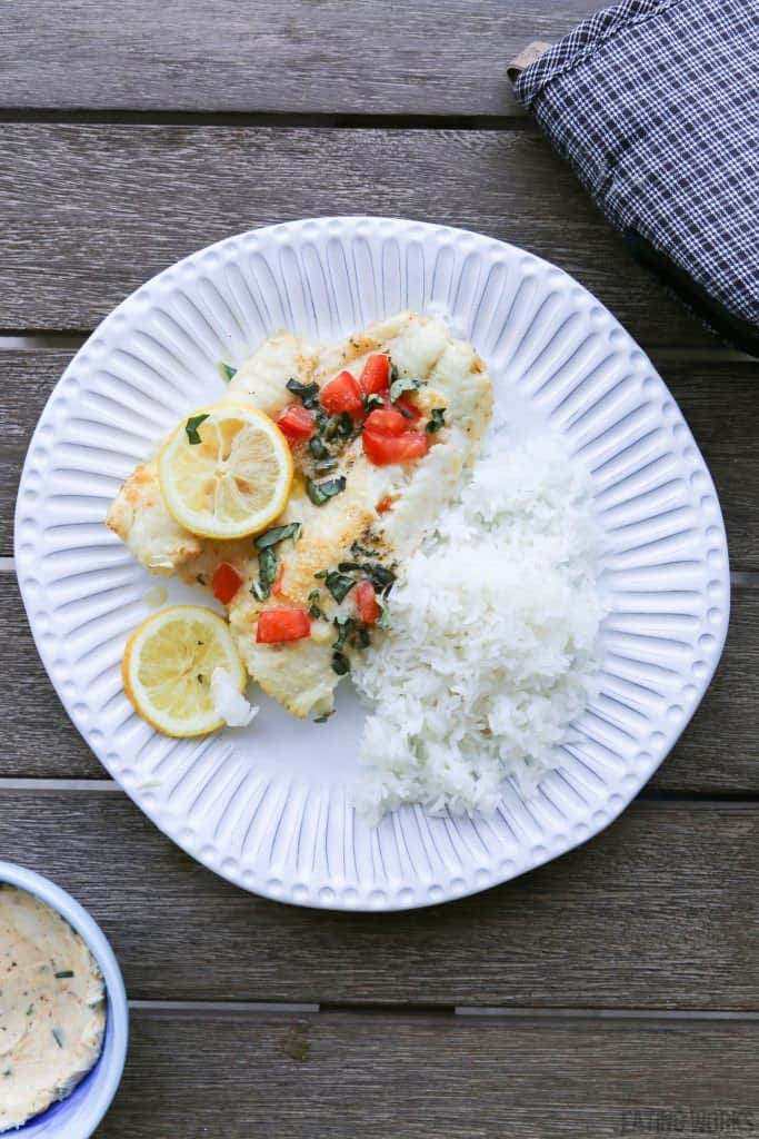 greek cod on a plate with rice