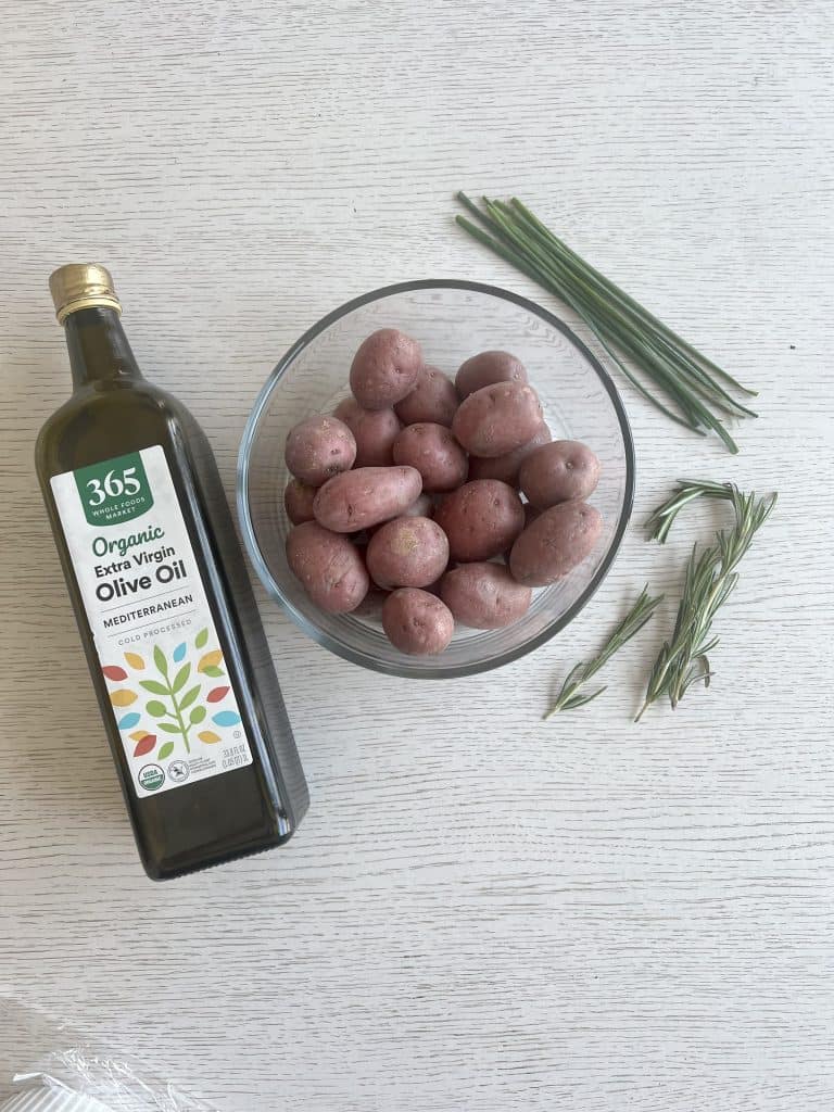 ingredients for air fryer red skin potatoes, olive oil red potatoes chives and rosemary