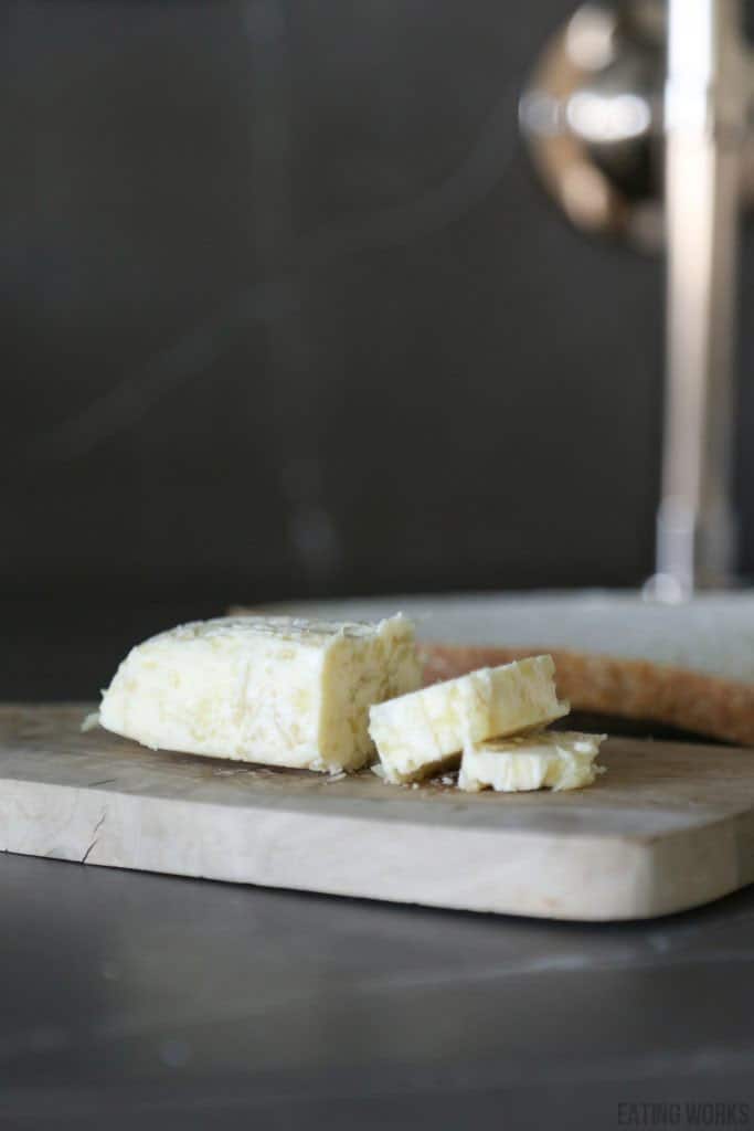 roasted garlic compound butter on a cutting board