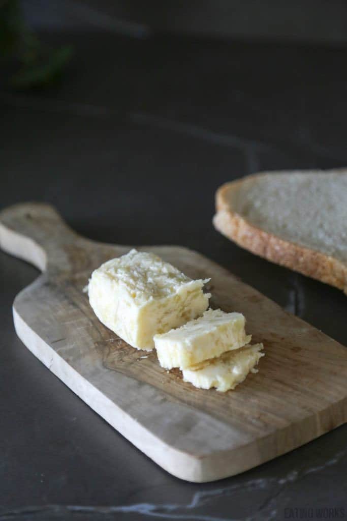 roasted garlic compound butter on a cutting board