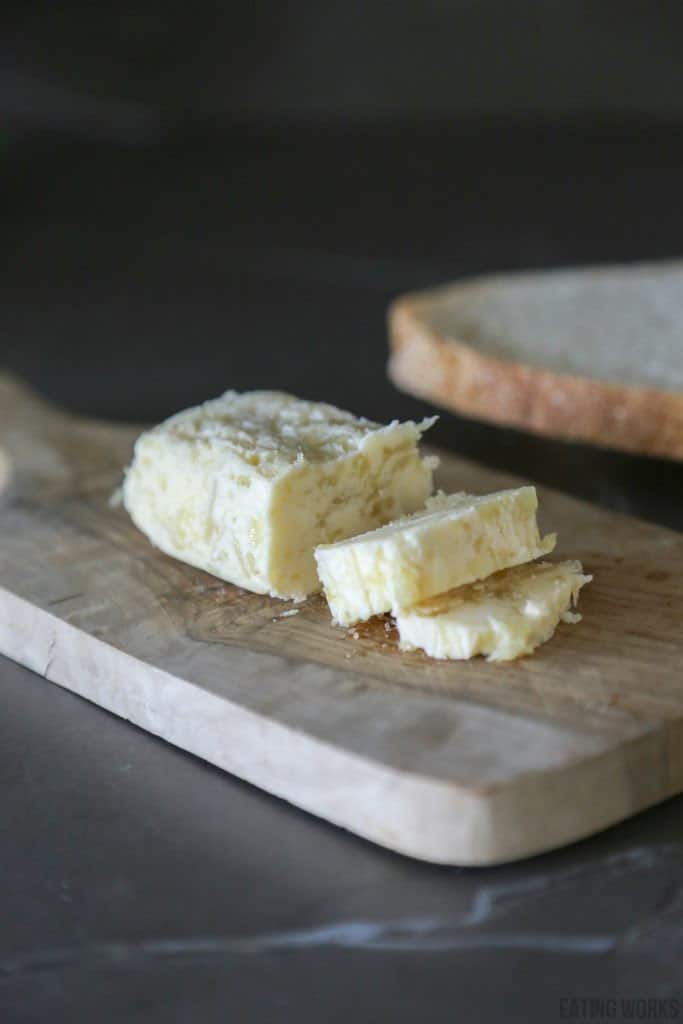 roasted garlic compound butter sliced on a cutting board