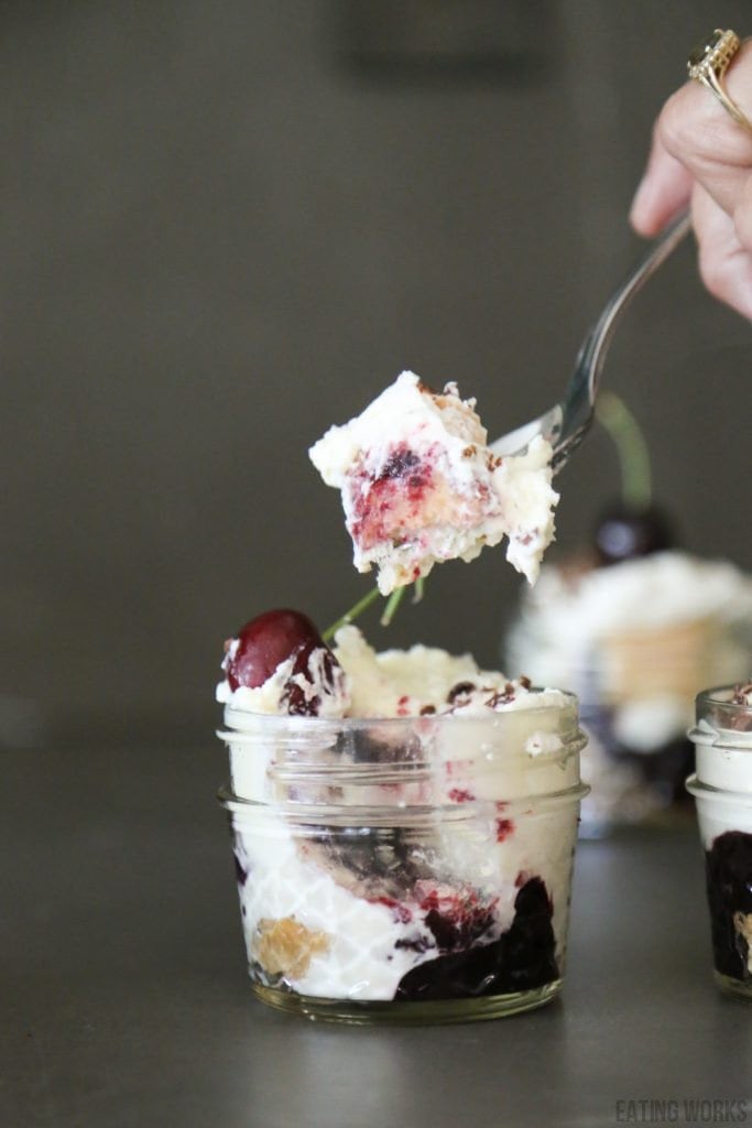 mini cherry tiramisu dessert cups with a spoon full scooped out