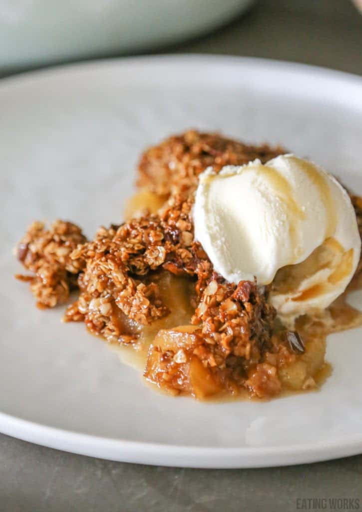 gluten free apple crumble without flour on a plate with a scoop of ice cream