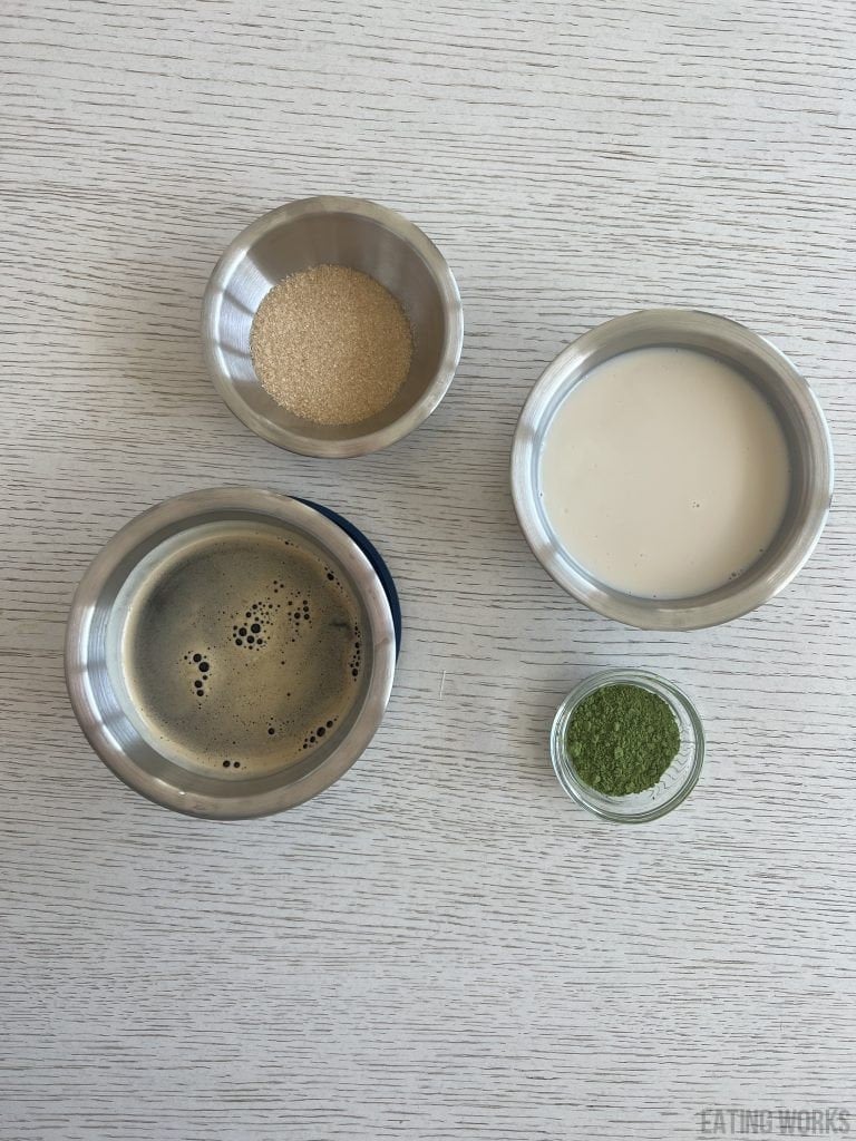 ingredients for dirty matcha latte matcha, oat milk, monk fruit crystals and espresso