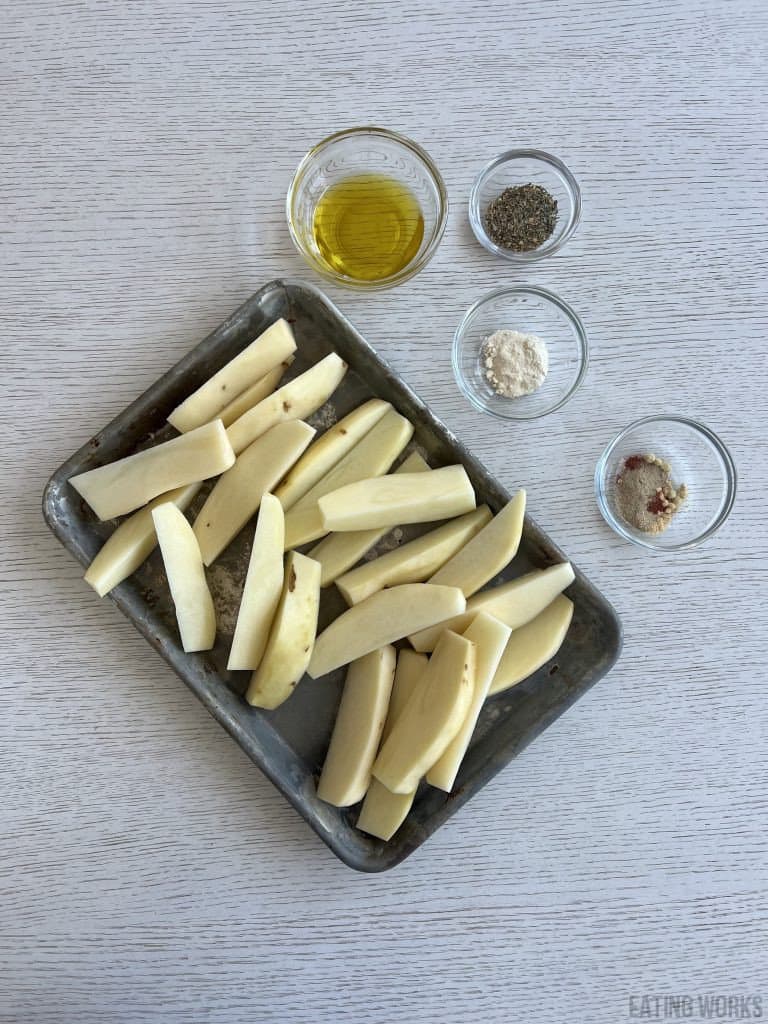 ingredients to make Buffalo Wild Wings Potato Wedges, potato wedges, olive oil, parmesan cheese, spices, Italian blend